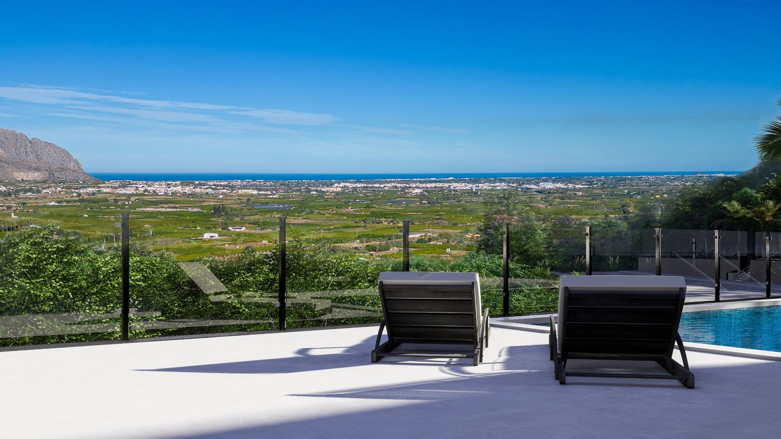 Pool terrace with sun loungers and sea, mountain and countryside views of a 3-bedroom villa in Pedreguer - The Estates