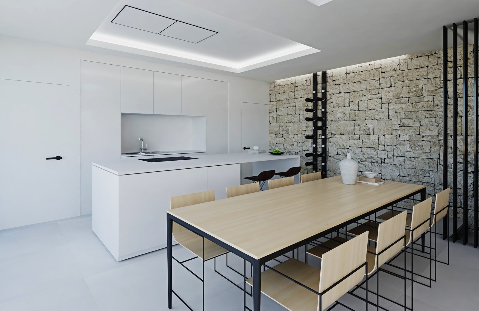 Modern kitchen and dining area with stone accent wall in a 4-bedroom penthouse in Calpe - The Estates