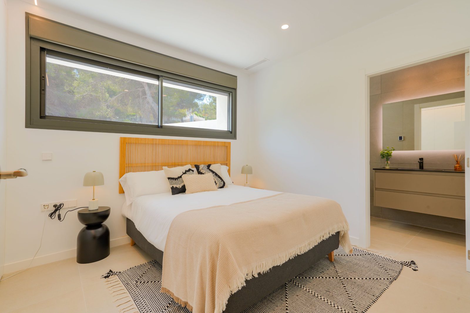 A stylish bedroom with countryside views in a 4-bedroom villa in Moraira - The Estates