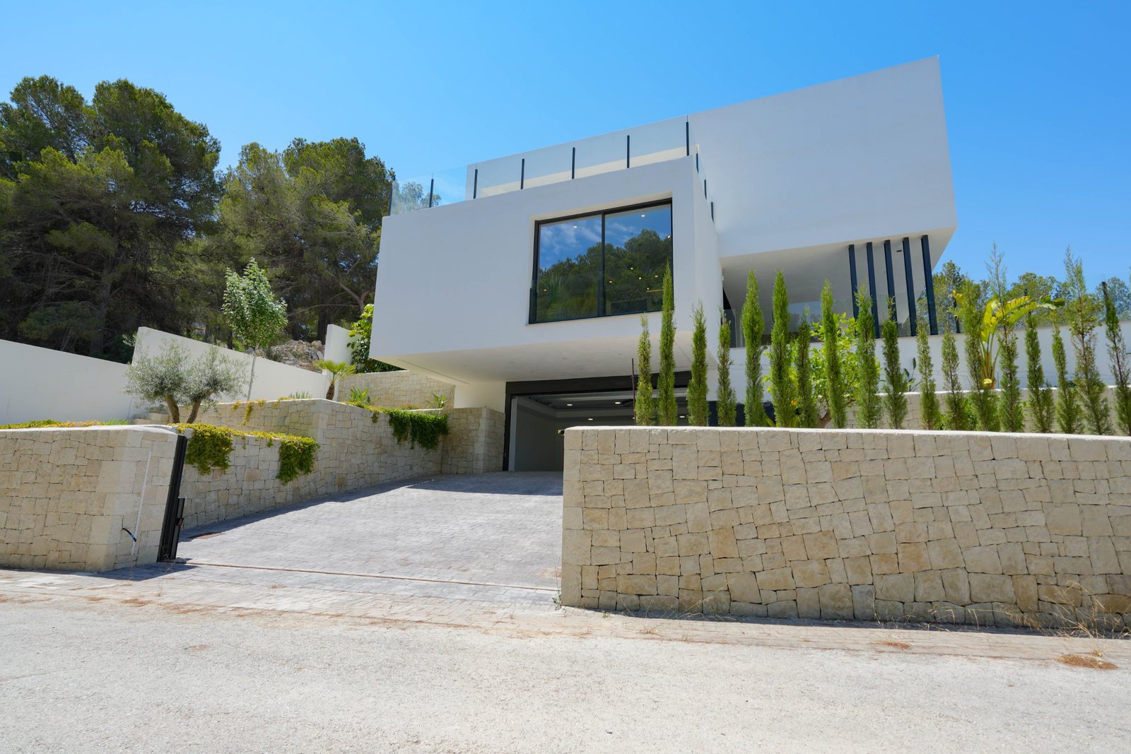 Modern exterior of a 4-bedroom villa in Moraira with countryside views - The Estates