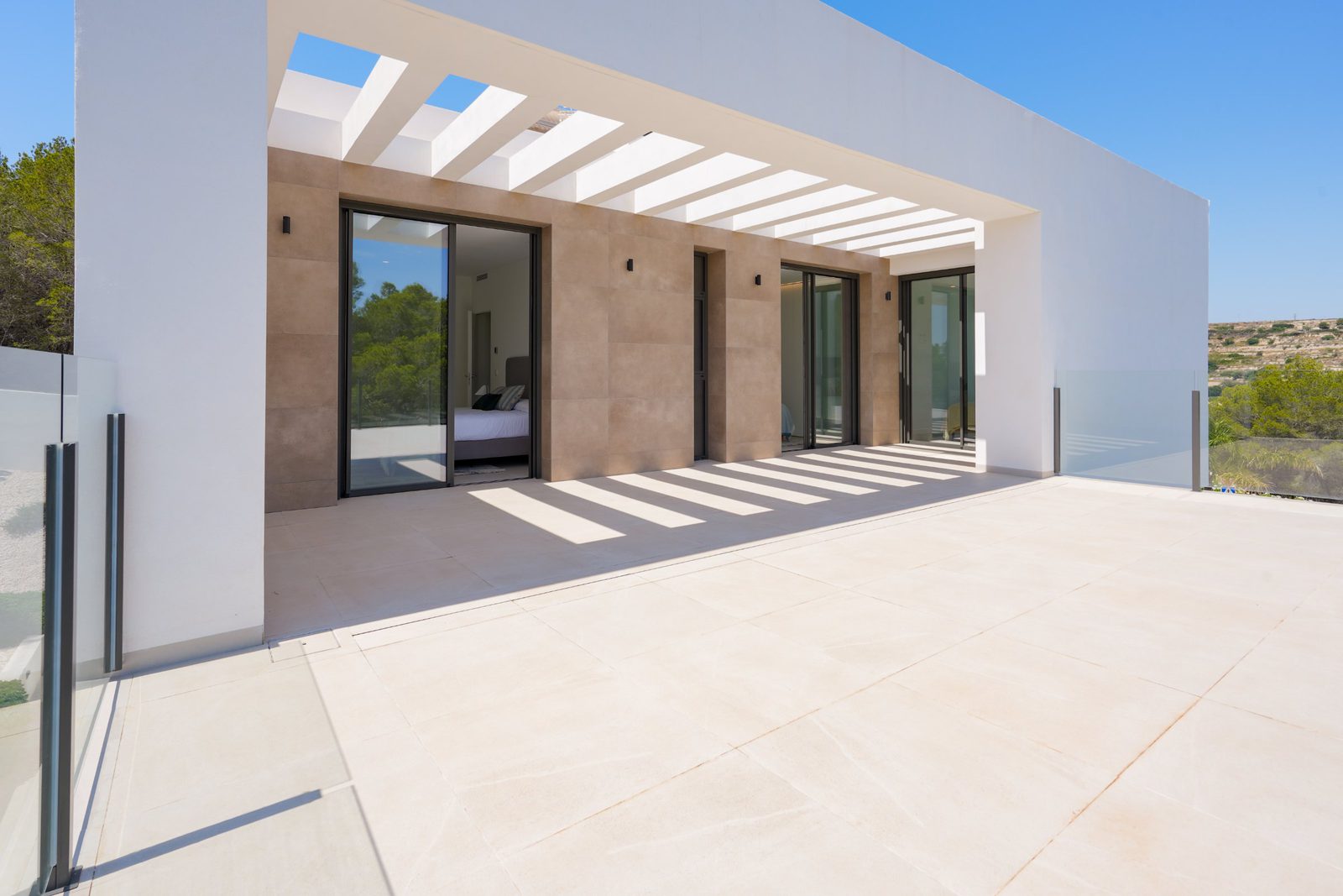 Modern exterior of a 4-bedroom villa in Moraira with countryside views - The Estates