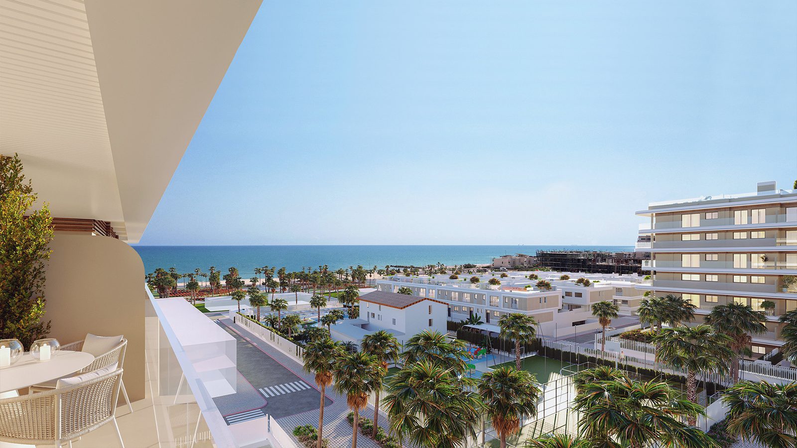 Balcony overlooking the sea, palm-lined resort and pools of a 2-bedroom penthouse in El Puig - The Estates