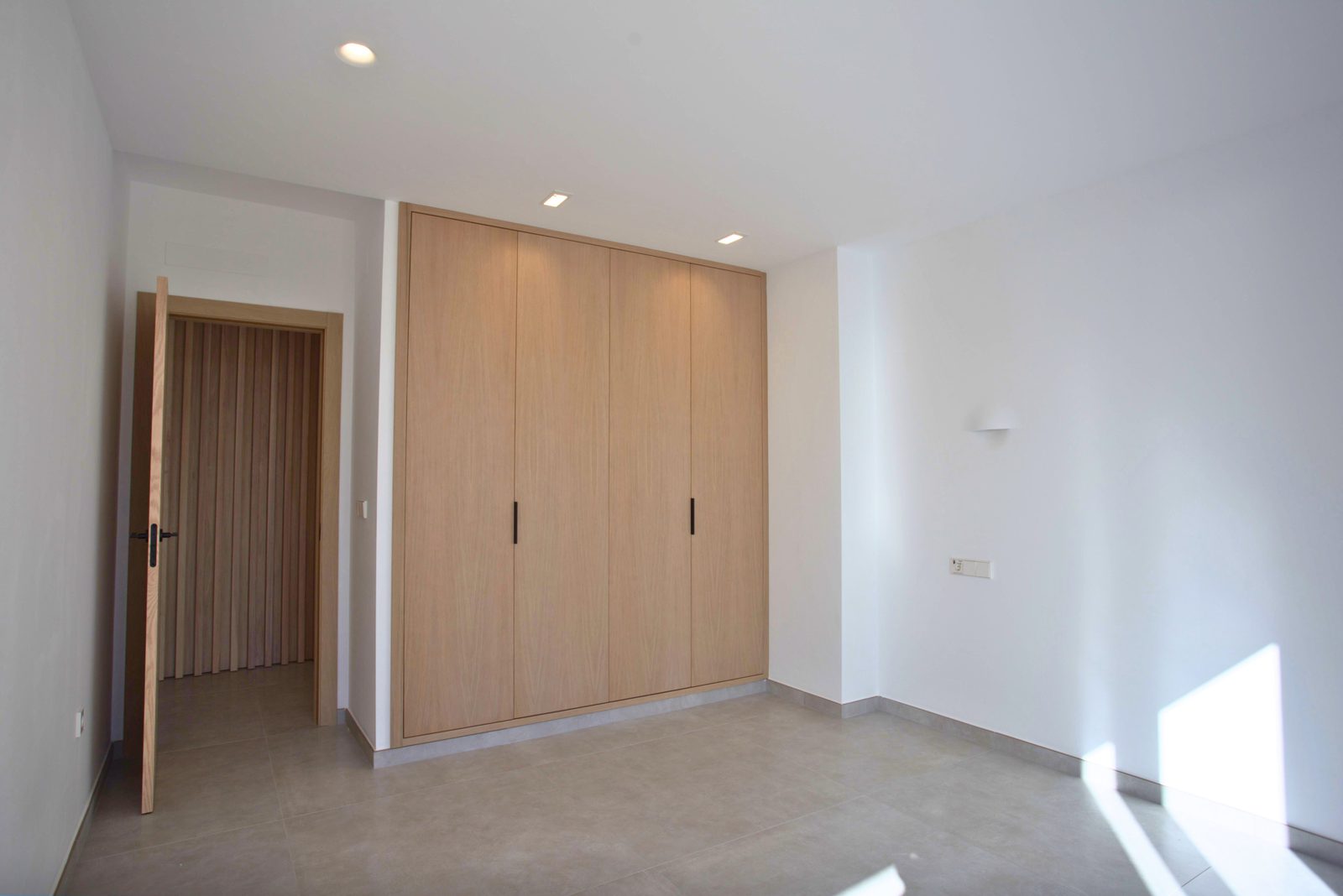 Built-in wardrobes in a bedroom of a 3-bedroom villa in Moraira - The Estates