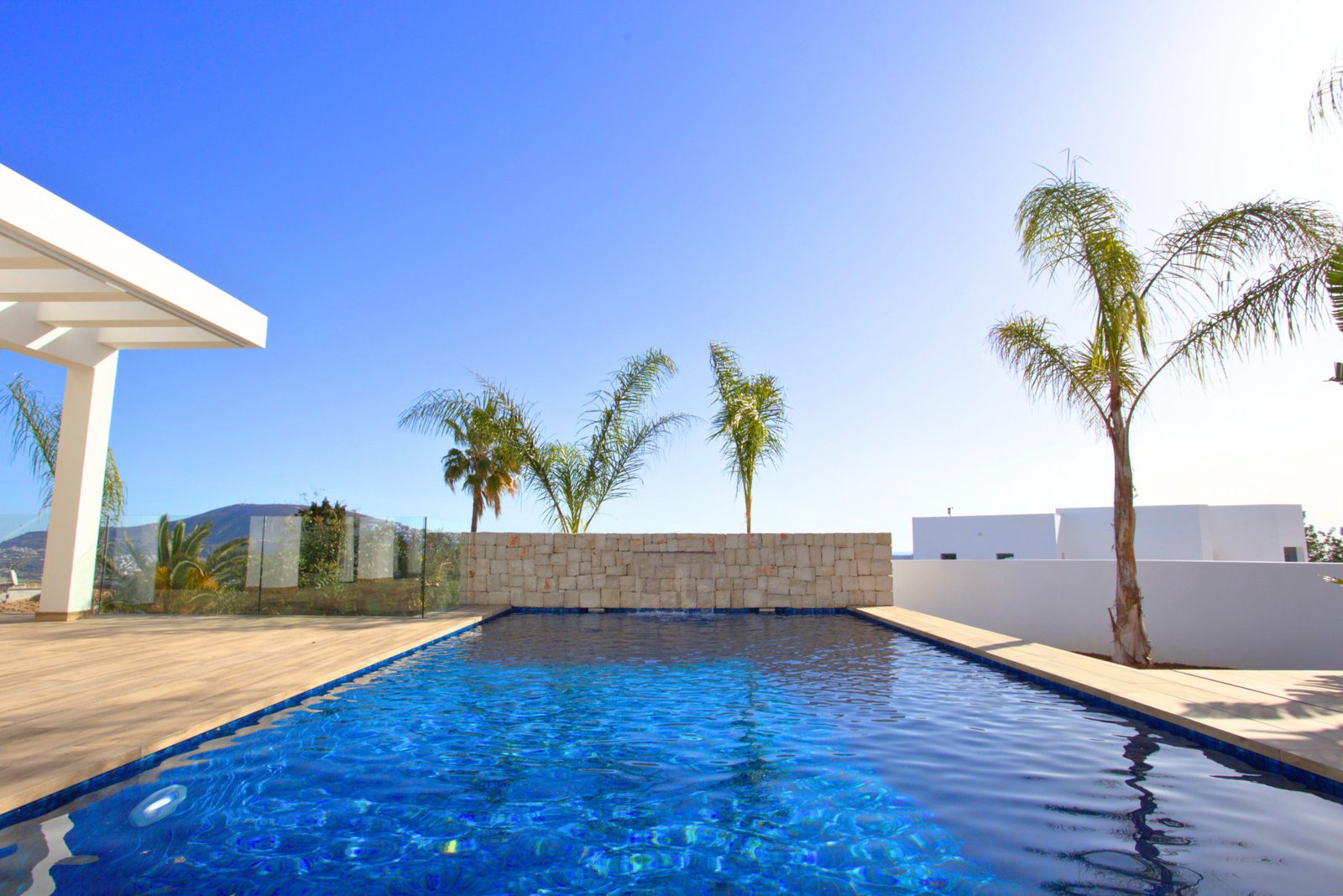 A sparkling pool and terrace area of a 3-bedroom villa in Moraira - The Estates