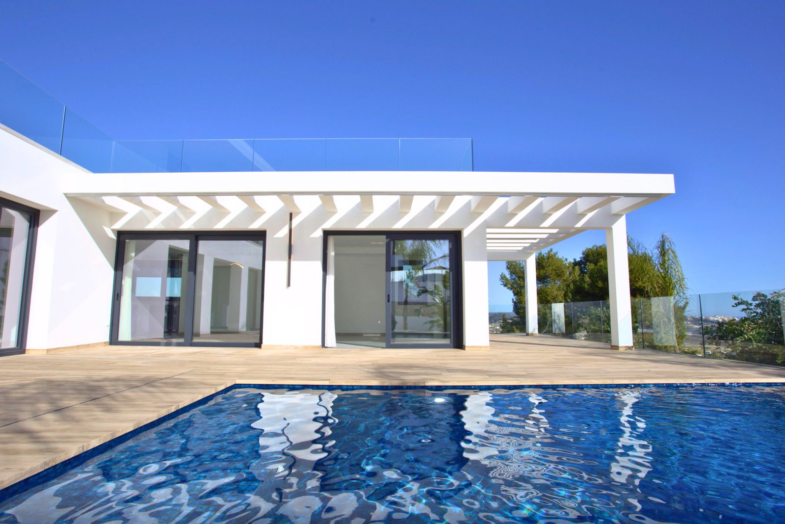 Modern villa exterior with a pool and sea views, a 3-bedroom villa in Moraira - The Estates