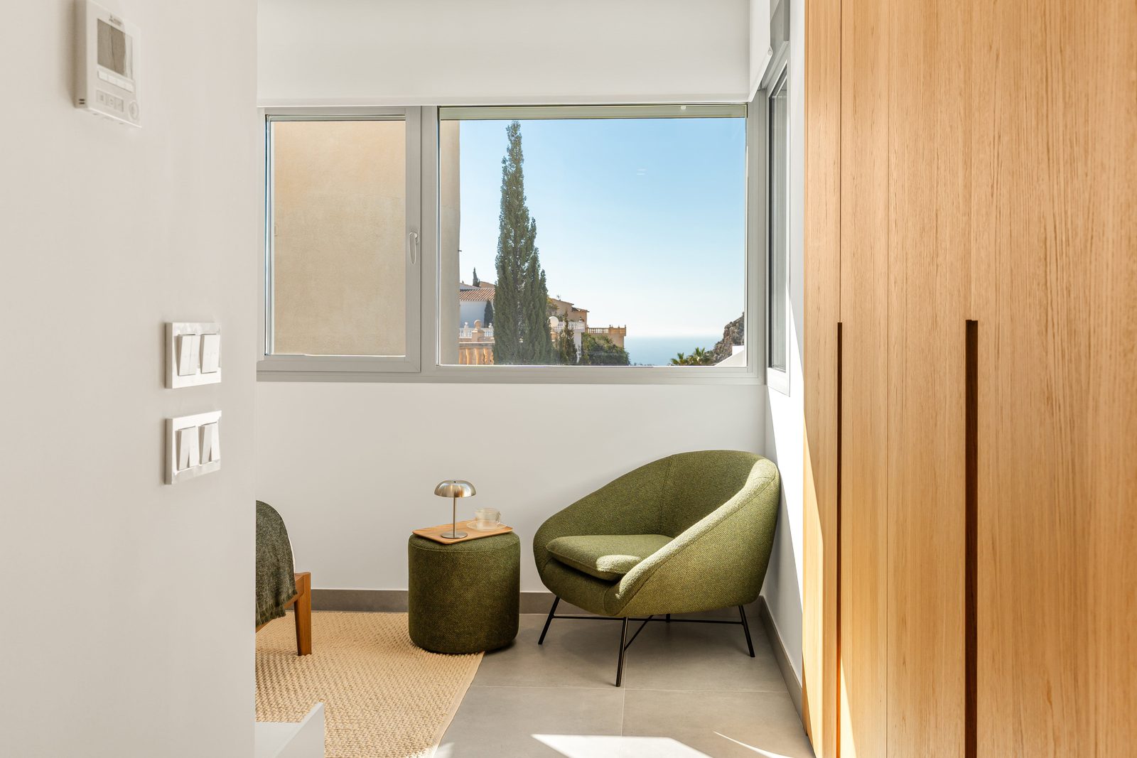 A cozy bedroom corner with sea views of a 3-bedroom villa in Benitachell - The Estates