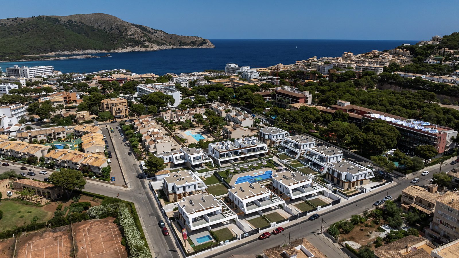 Aerial view of the coastal town, sea and modern homes of