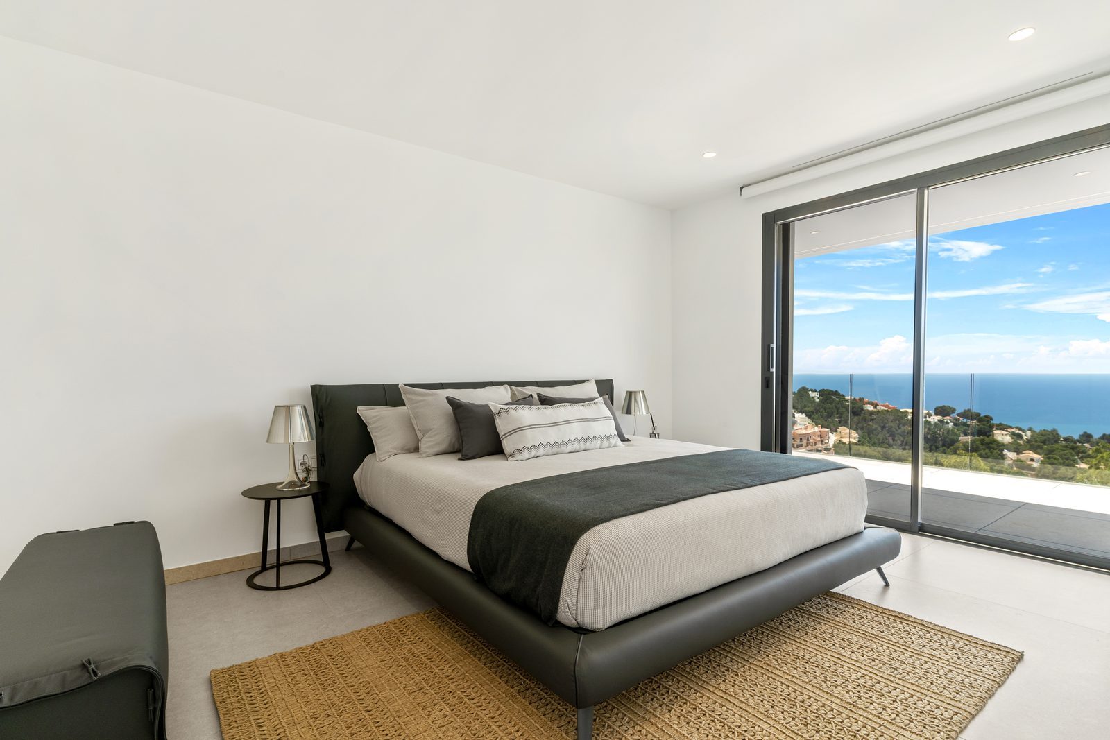 Modern bedroom with panoramic sea views in
