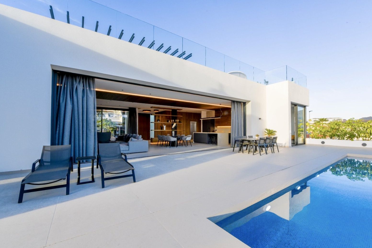 Modern living area and pool terrace of a 4-bedroom villa in La Nucia - The Estates