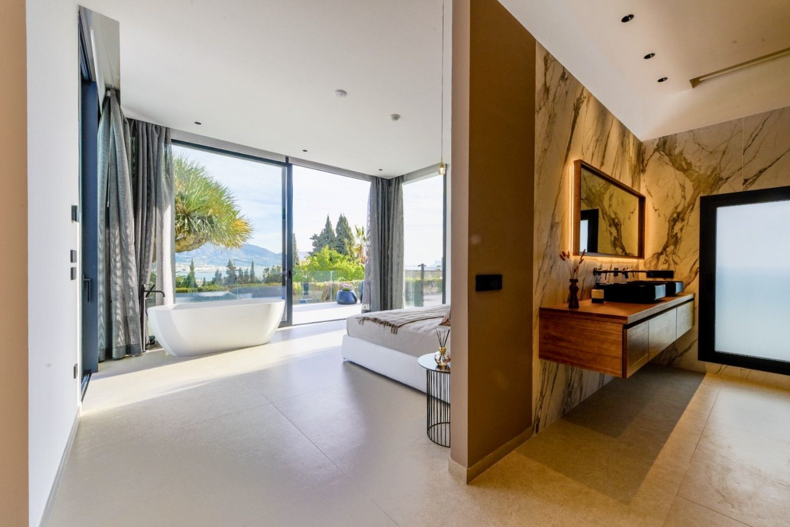 Luxurious bathroom with a freestanding tub and stunning sea views in a 4-bedroom villa in La Nucia - The Estates