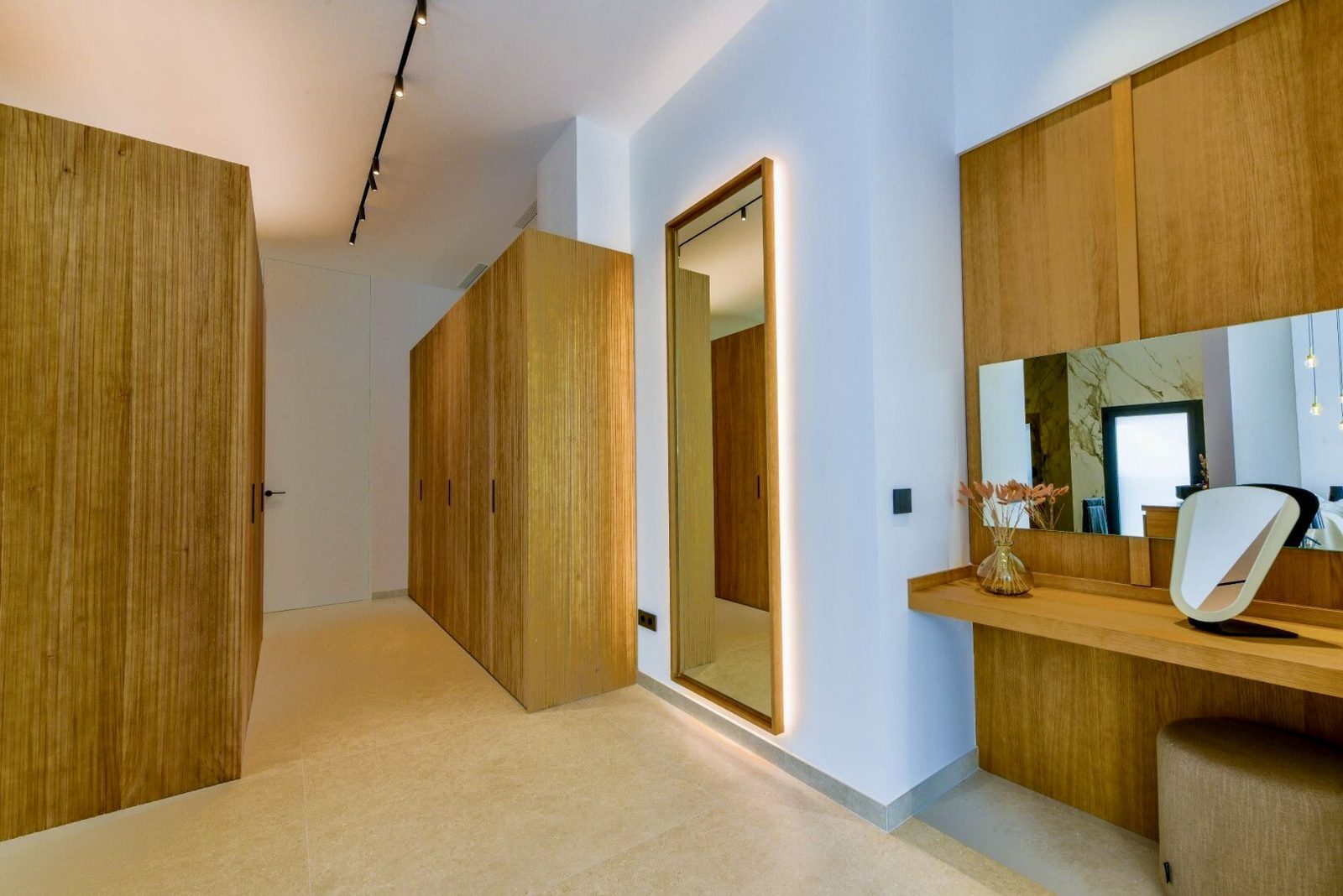 Stylish bedroom with built-in wardrobes and a vanity area in a 4-bedroom villa in La Nucia - The Estates