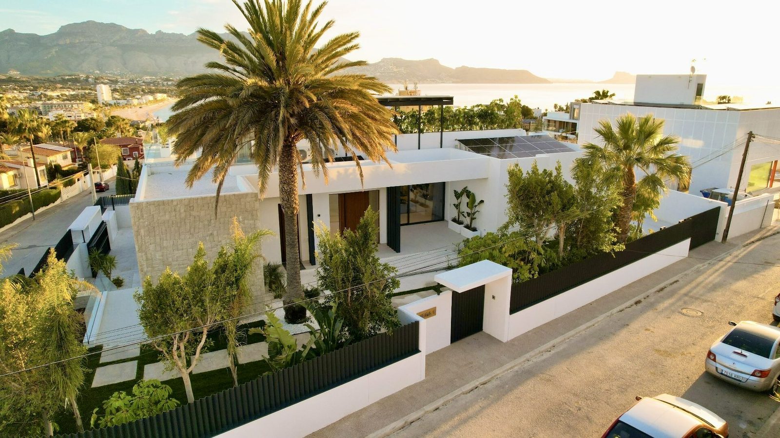 A modern villa with palm trees and sea views in Albir, La Nucia - The Estates