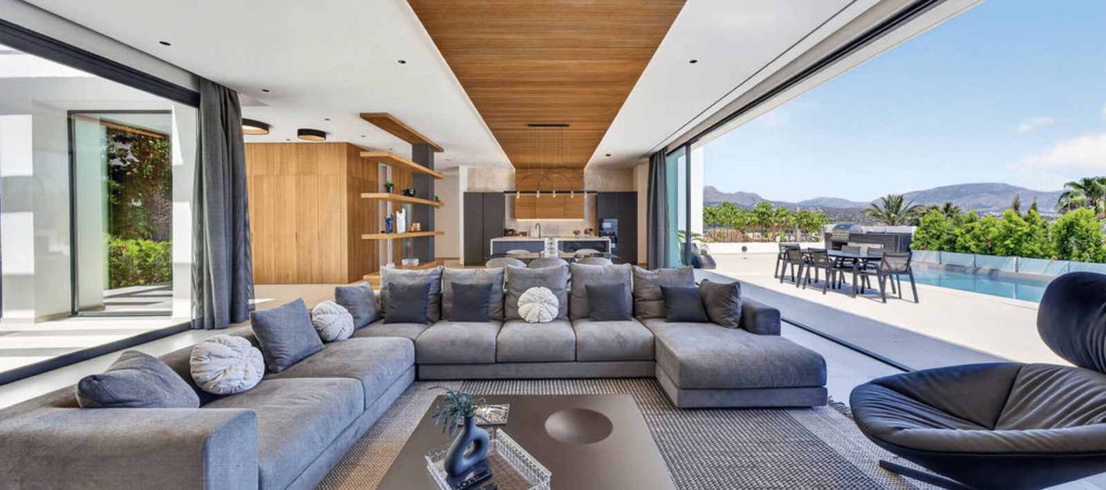Stylish living room with sea views inside a 4-bedroom villa in La Nucia - The Estates