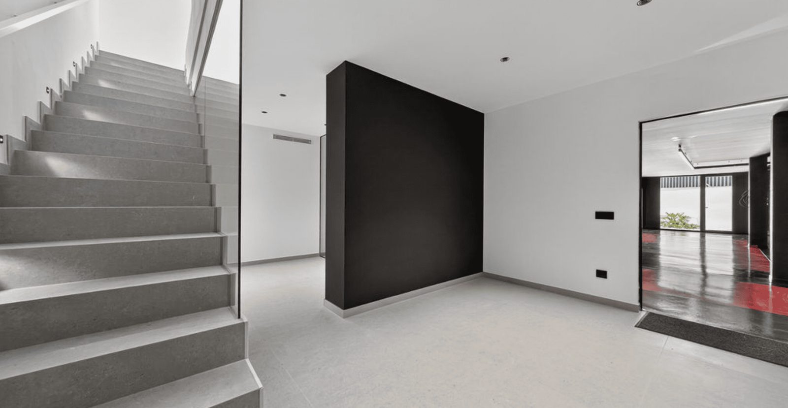Modern interior hallway with staircase and mirror in a 4-bedroom villa in La Nucia - The Estates