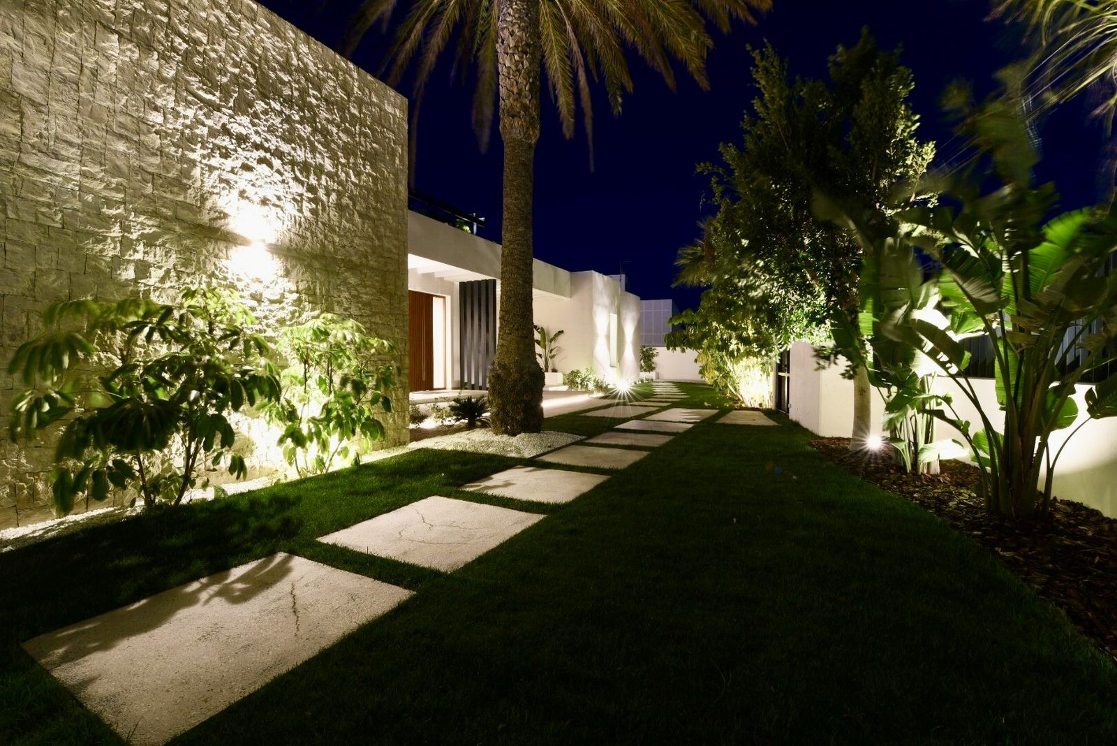 Beautifully lit garden path and exterior of a 4-bedroom villa in La Nucia - The Estates