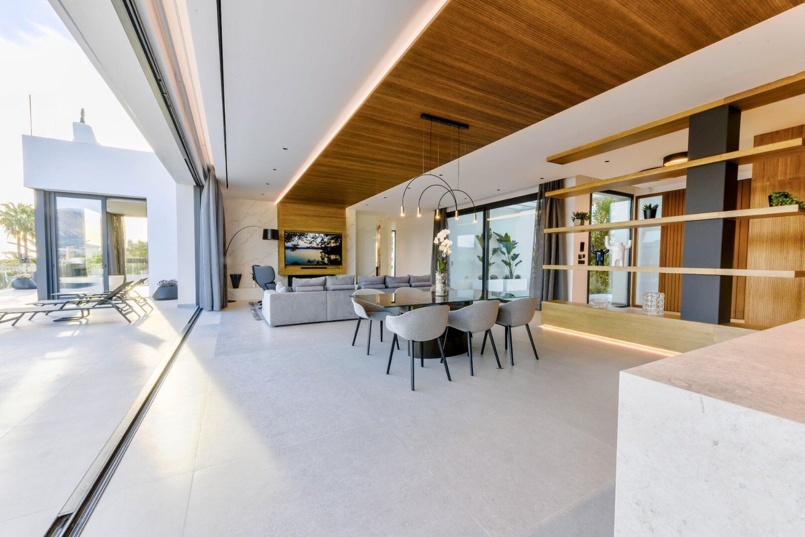 Stylish living room with sea views inside a 4-bedroom villa in La Nucia - The Estates