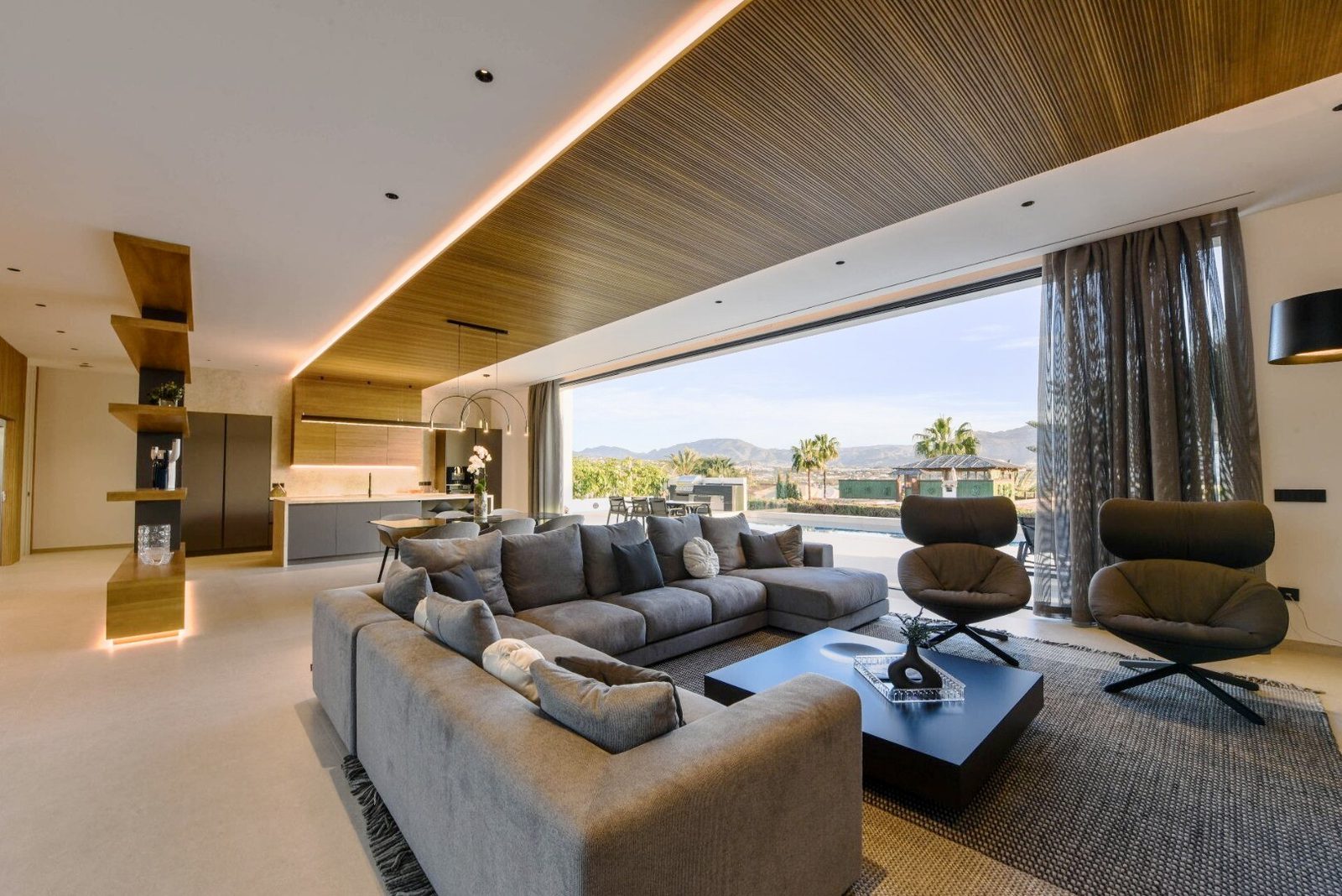 Stylish living room with sea and city views in a 4-bedroom villa in La Nucia - The Estates