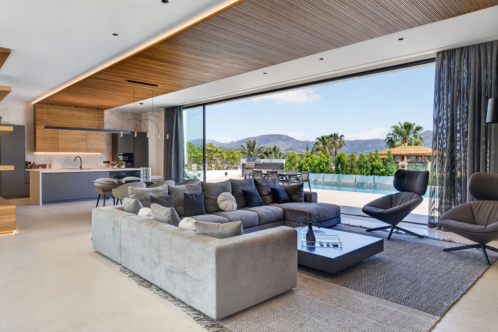 Stylish living room with sea and city views in a 4-bedroom villa in La Nucia - The Estates