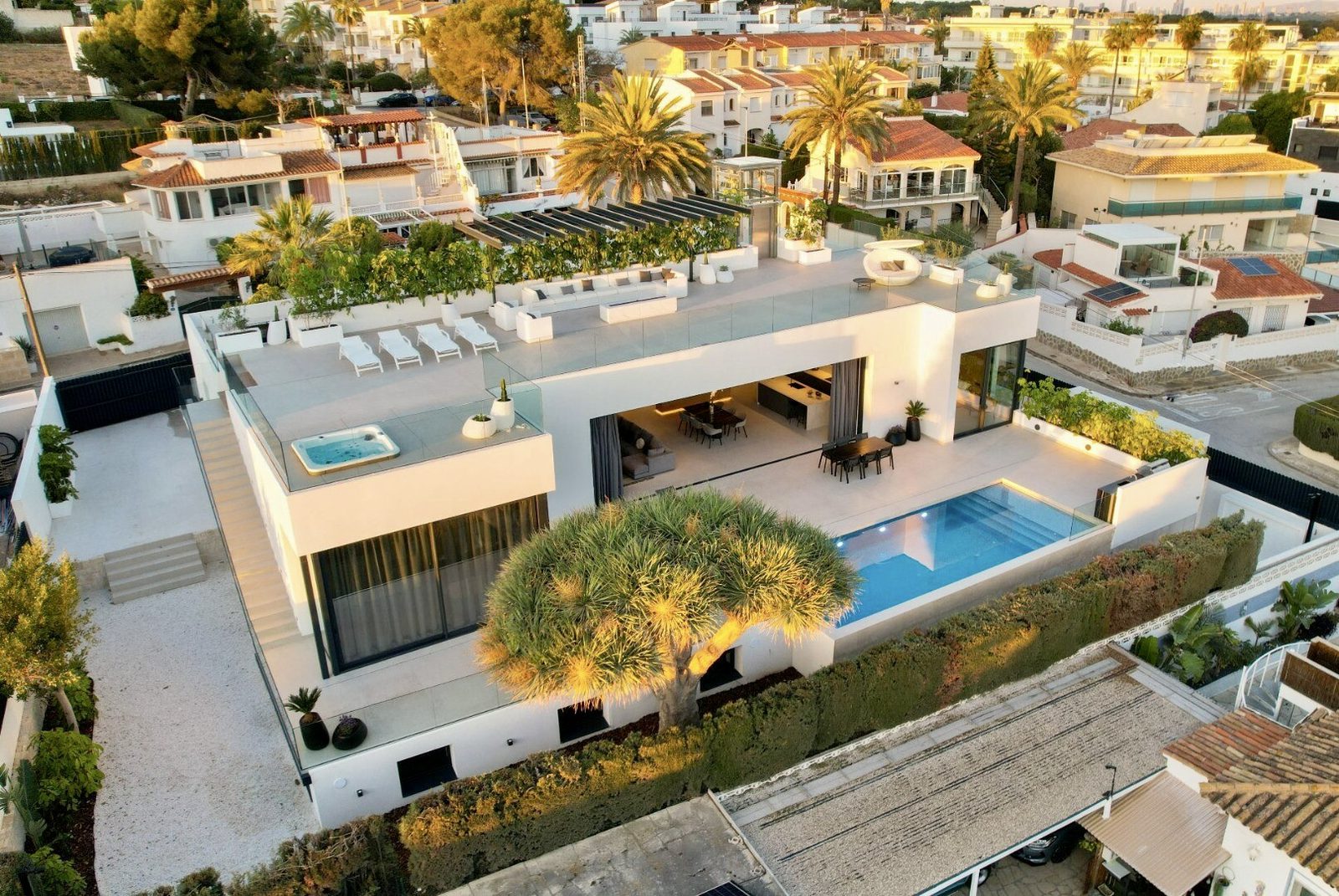 An aerial view of a modern 4-bedroom villa with a pool and terrace in La Nucia - The Estates