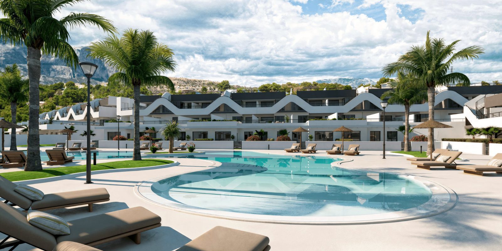 A view of a 2-bedroom apartment with a pool and mountain backdrop in Alfaz del Pi - The Estates