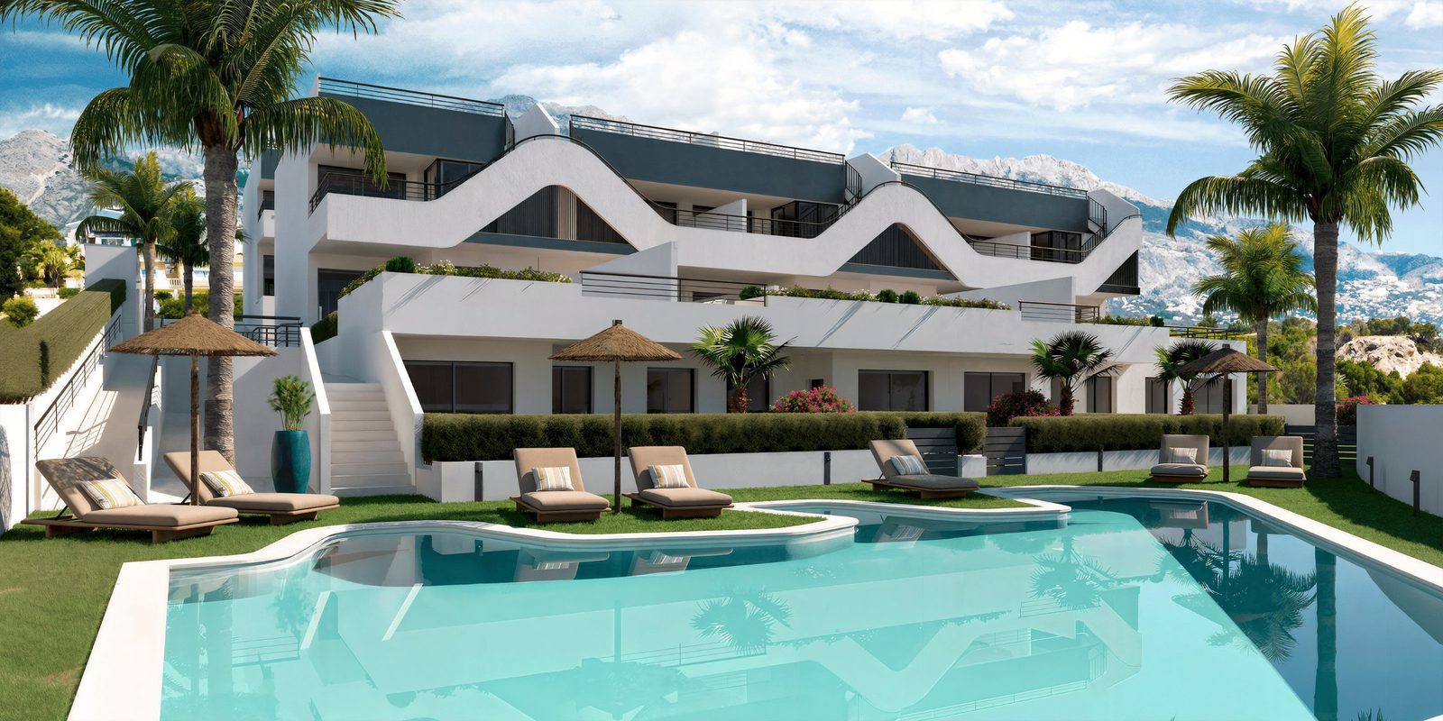 A modern apartment building with a pool and mountain views, showcasing a 2-bedroom apartment in Alfaz del Pi - The Estates
