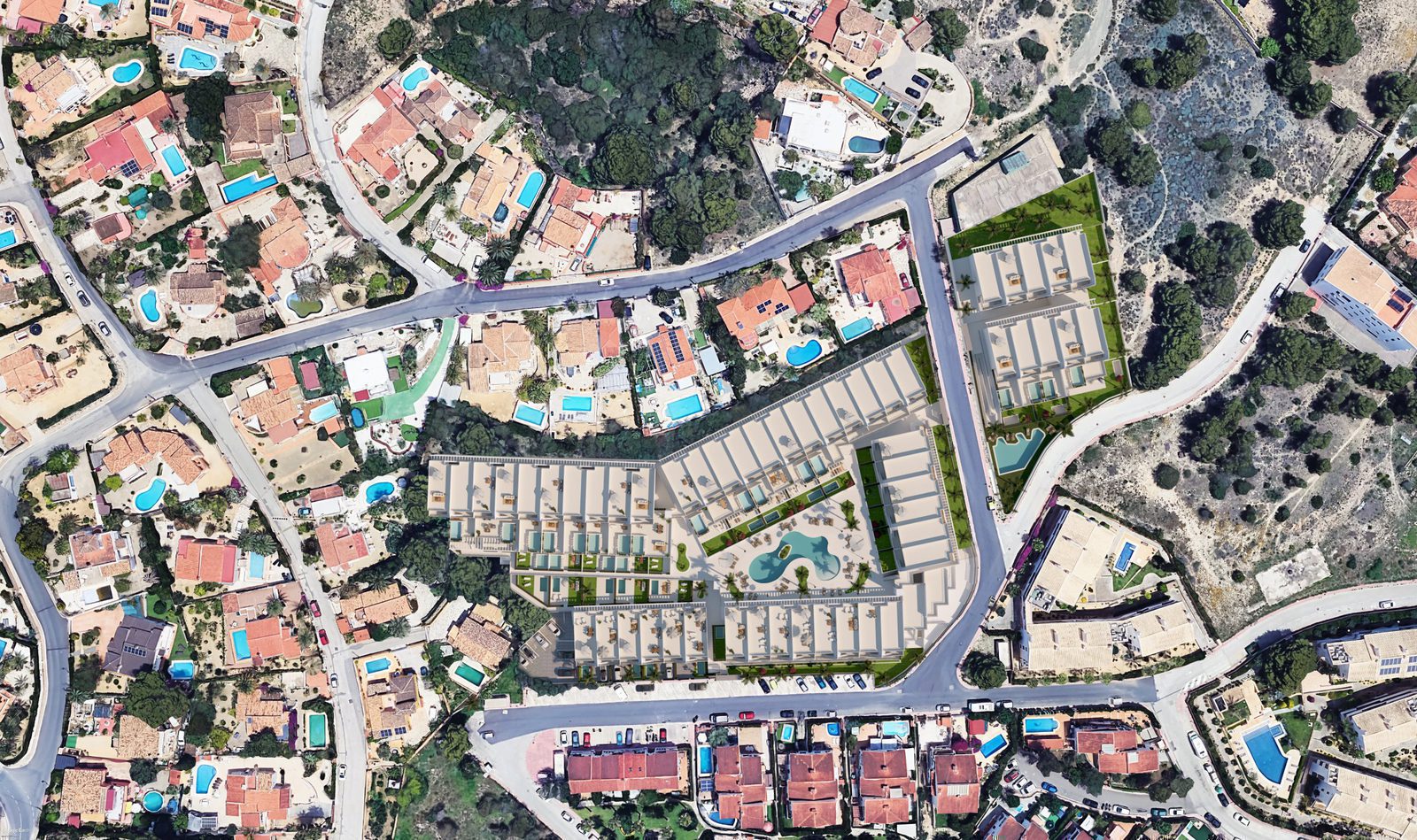 Aerial view of a 2-bedroom apartment complex nestled amongst greenery in Alfaz del Pi - The Estates