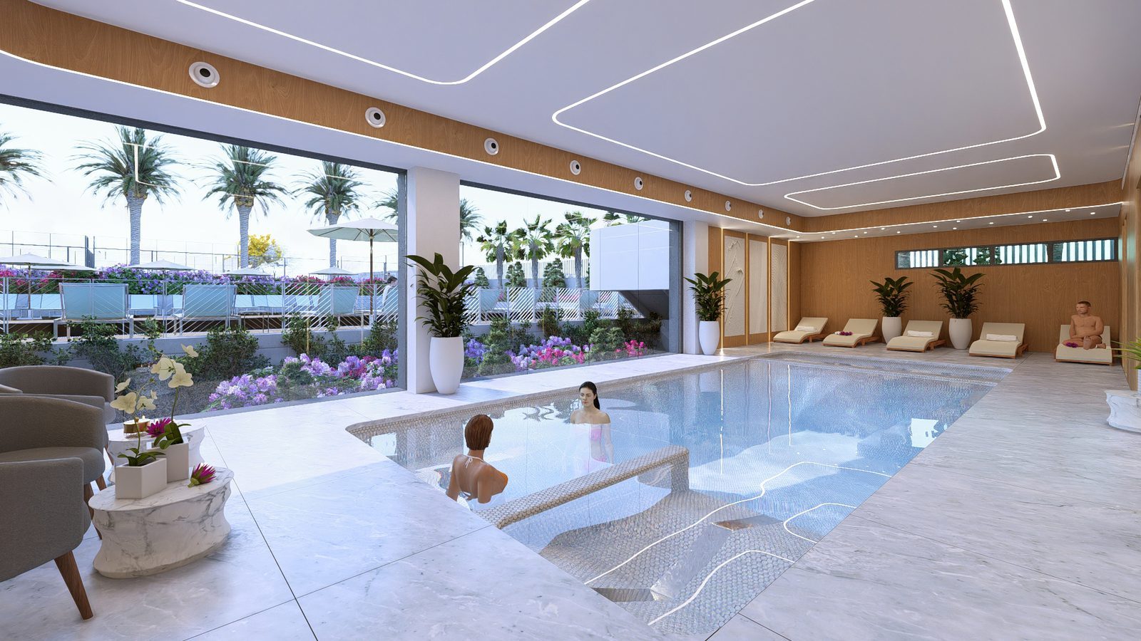 Indoor swimming pool and spa area with loungers and garden views of a 2-bedroom apartment in Torrevieja - The Estates