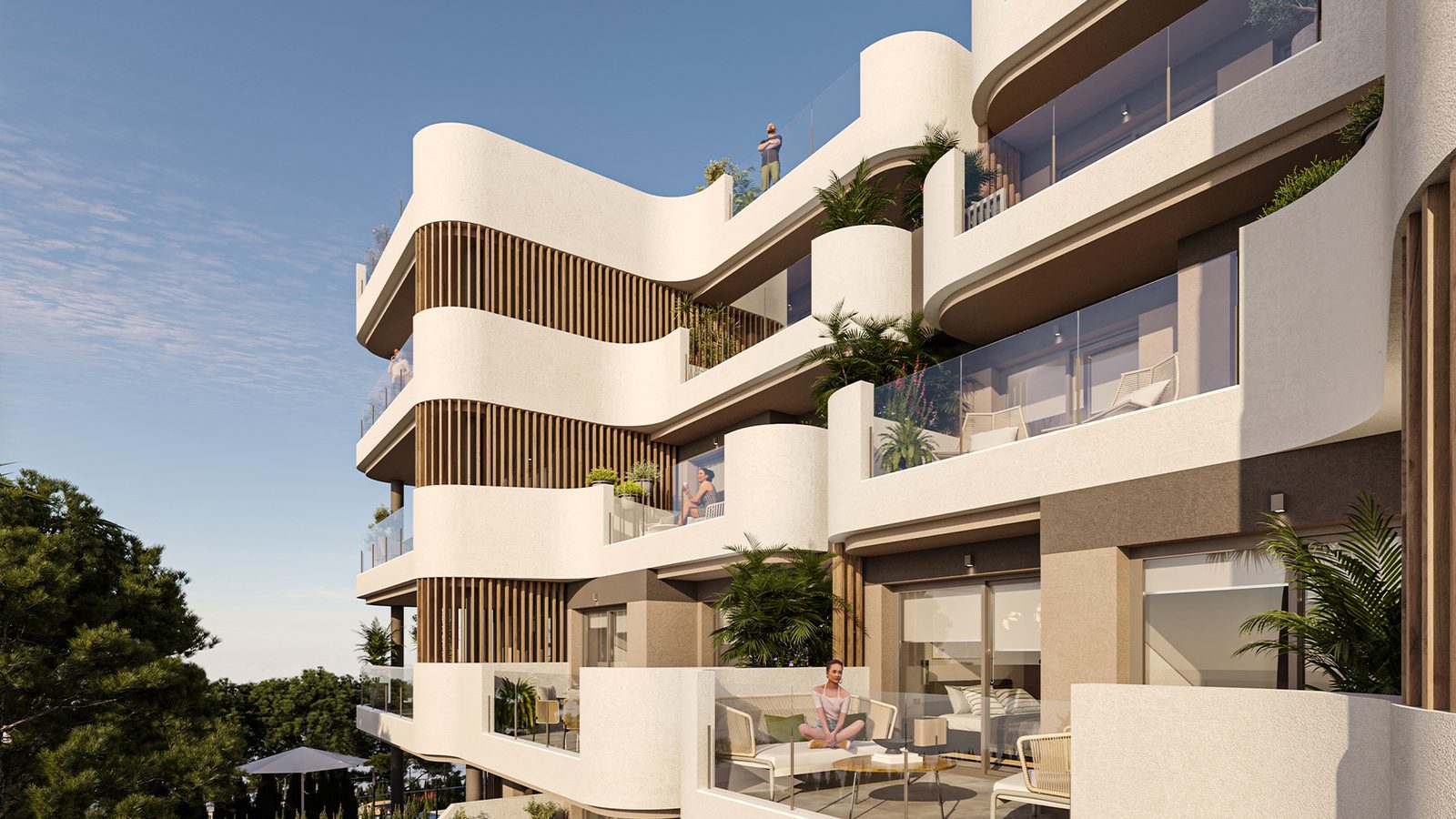 Modern apartment exterior with curved balconies, glass railings and tropical plants of a 2-bedroom apartment in Capdepera - The Estates