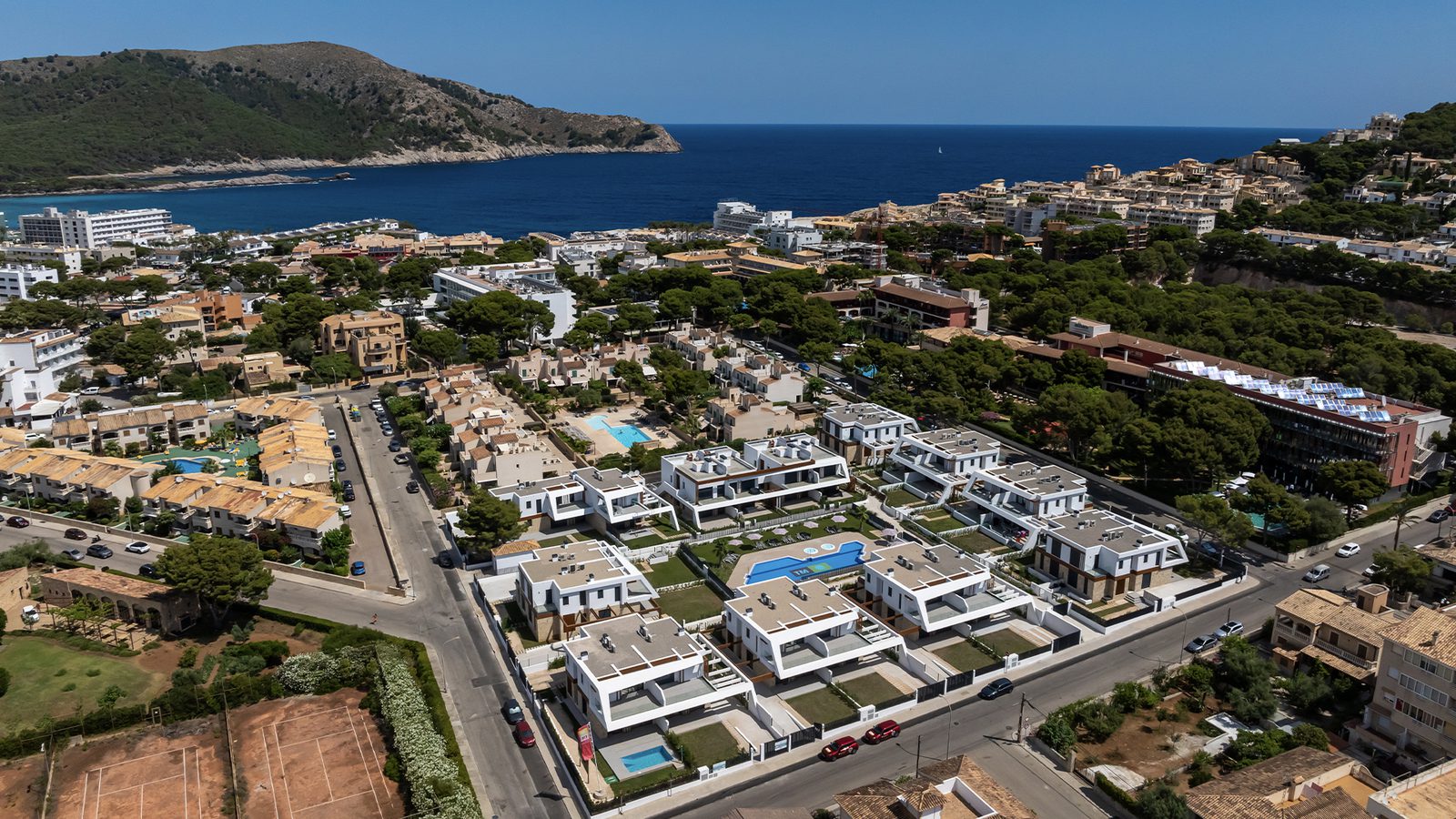 An aerial view of a coastal town with a 3-bedroom semi-detached property - The Estates