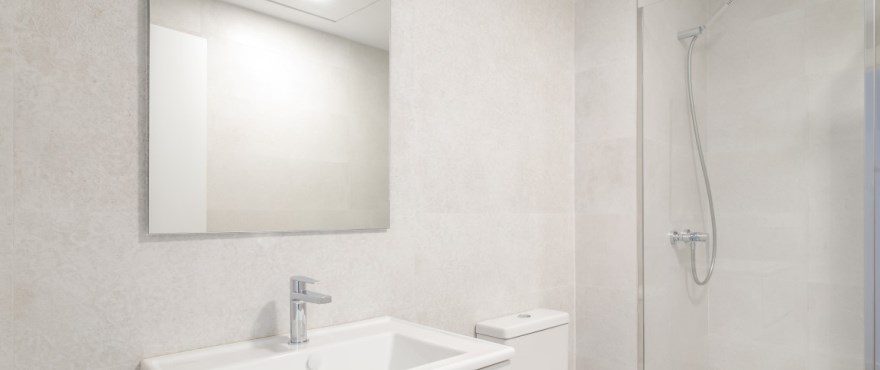 Modern bathroom with vanity, mirror and walk-in shower