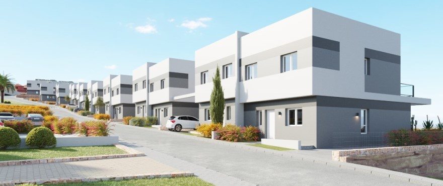Street view of modern white villas with landscaped gardens