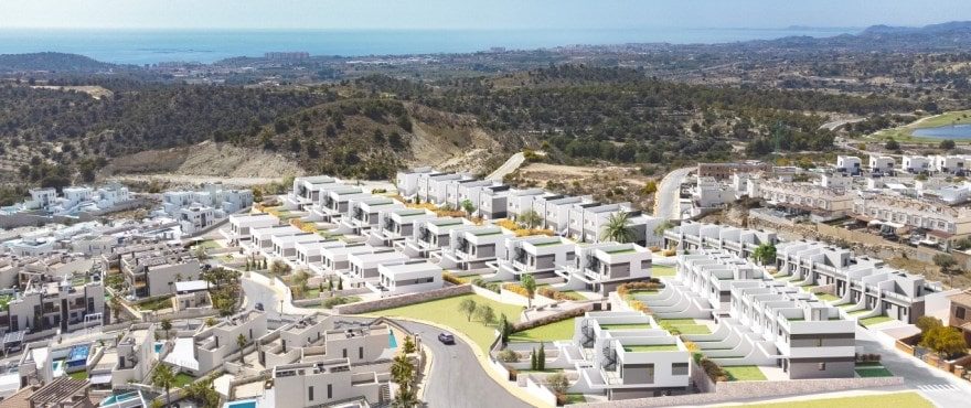 Aerial view of a modern villa development and sea views in Finestrat of a 4-bedroom villa in Finestrat - The Estates