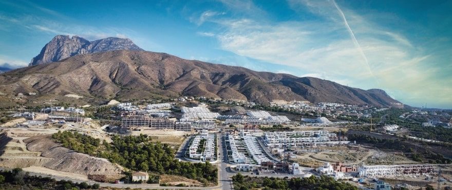 Aerial view of Finestrat residential developments beneath the Puig Campana mountain of a 4-bedroom villa in Finestrat - The Estates