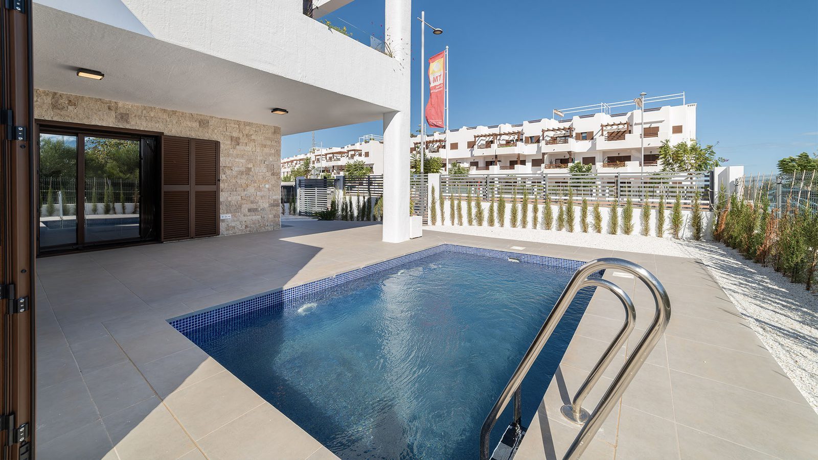 A private pool and covered terrace of a 2-bedroom semi-detached in Pulpí - The