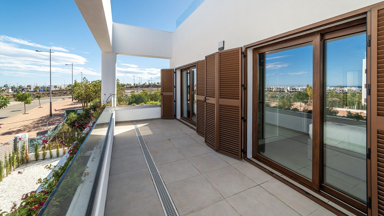 Spacious terrace with wooden shutters and views over the landscaped development at a 2-bedroom semi-detached in Pulpí - The Estates