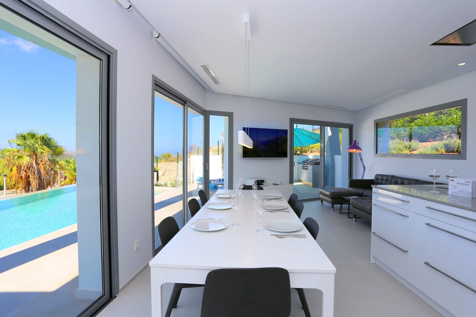 Modern dining area with sea views inside a 4-bedroom chalet in Javea - The Estates