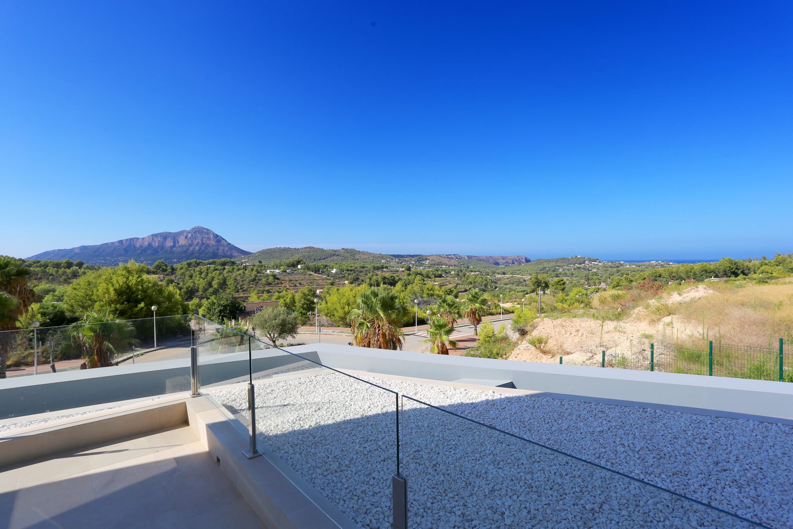 Panoramic sea and mountain views from a 4-bedroom chalet in Javea - The Estates