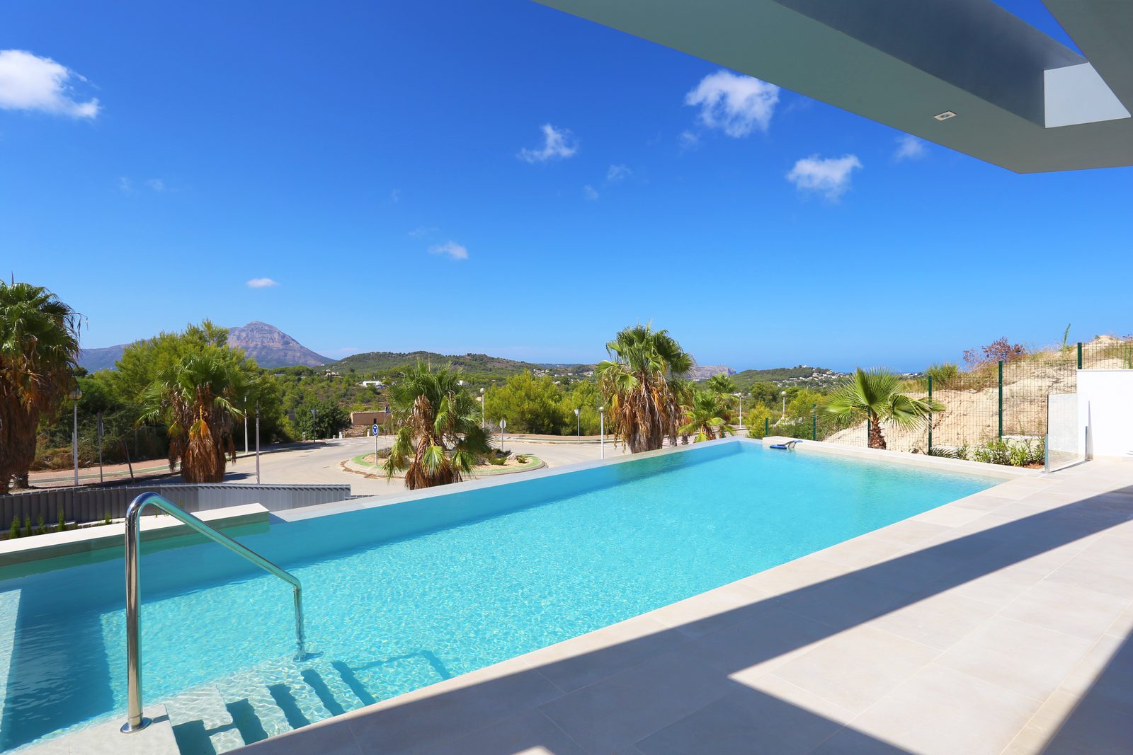 A stunning pool and mountain views from a 4-bedroom chalet in Javea - The Estates