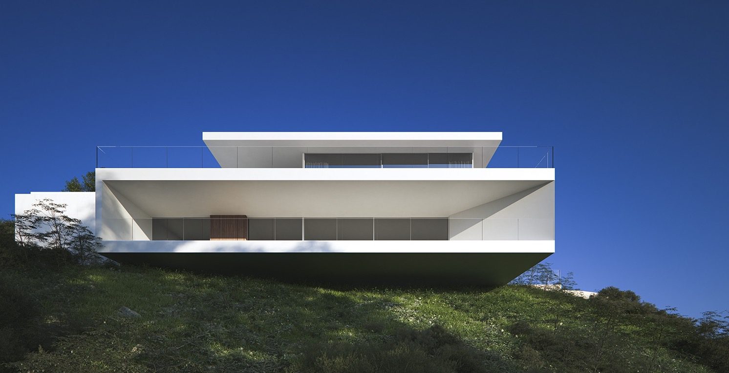 Modern villa exterior with sea, mountain, and city views of a 5-bedroom villa in Moraira - The Estates