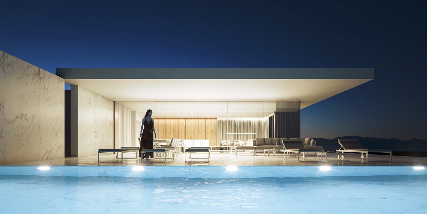 A modern villa's pool and terrace at dusk, showcasing its elegant design in Moraira - The Estates