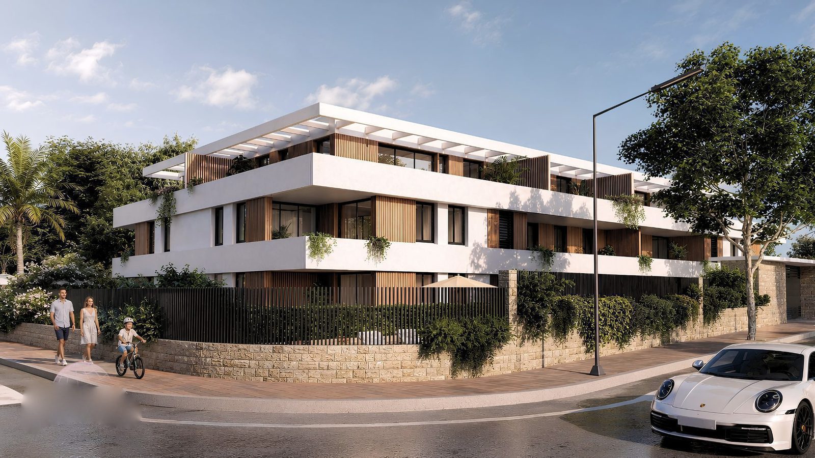 Exterior view of a modern 2-bedroom apartment building with a garden in Jávea - The Estates