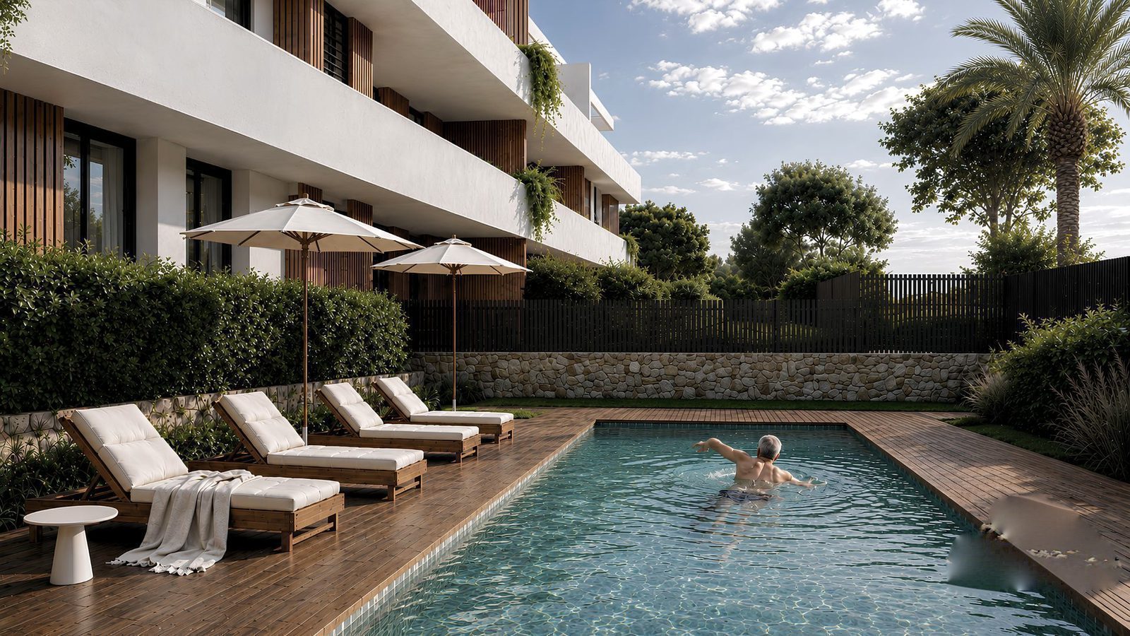 Exterior view of a 2-bedroom apartment with a pool and garden in Jávea - The Estates