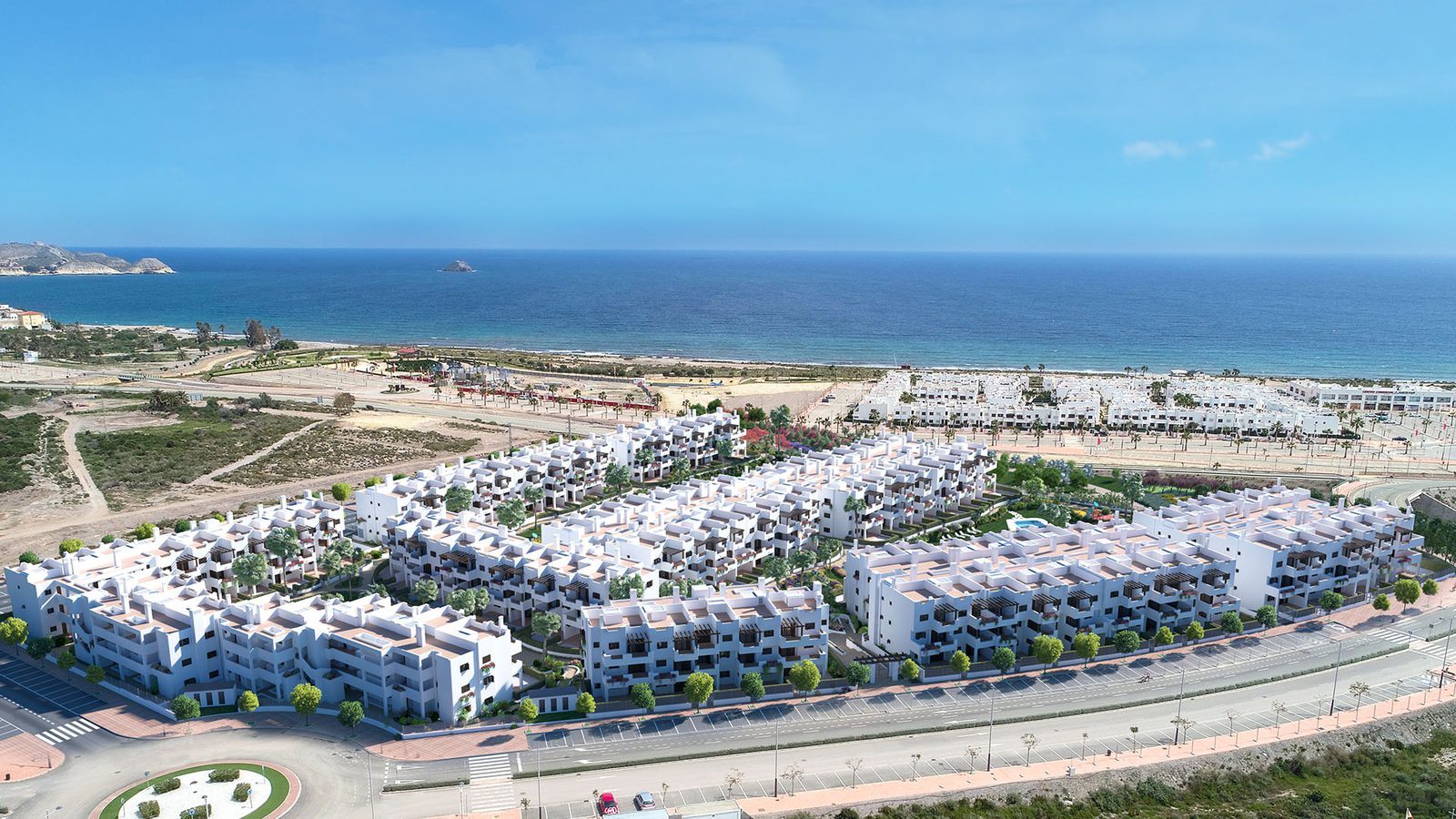Aerial view of a coastal bungalow development beside the beach and sea in Pulpí, featuring a 2-bedroom