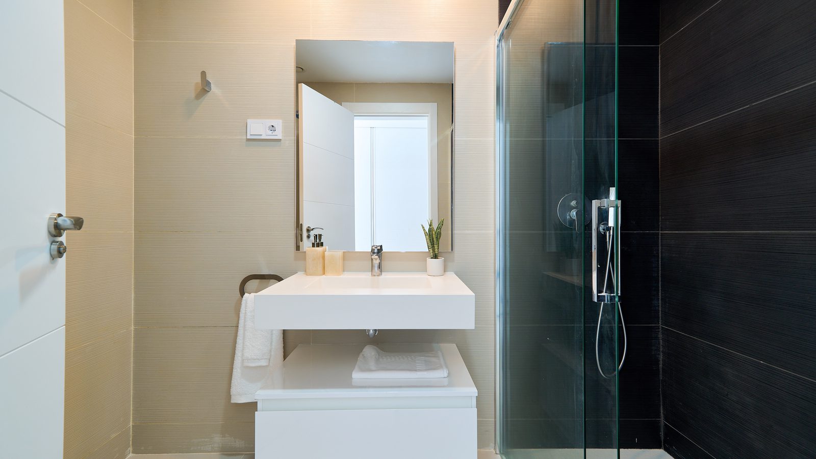 A modern bathroom with a walk-in shower in a 2-bedroom apartment in Estepona - The Estates