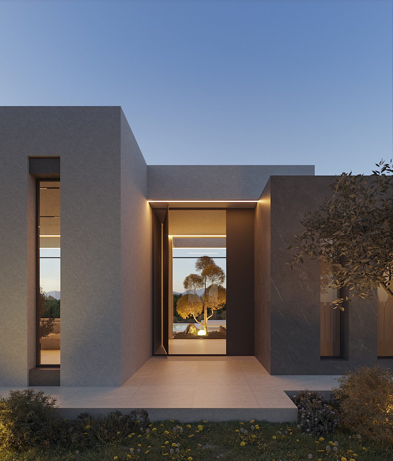 Modern villa entrance with landscaped garden at dusk, of a 3-bedroom villa in Calpe - The Estates