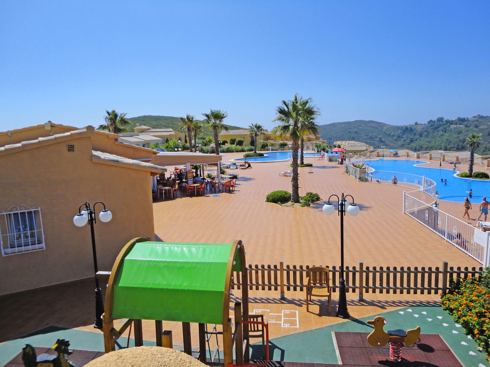 Pool and community area view from a 3-bedroom apartment in Benitachell - The Estates