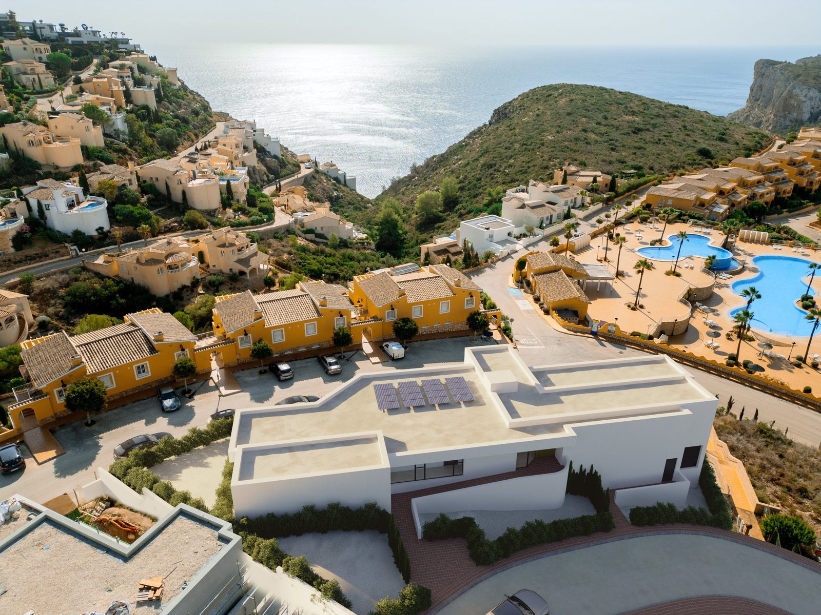 Panoramic view of a 3-bedroom apartment complex in Benitachell, overlooking the Mediterranean Sea - The Estates