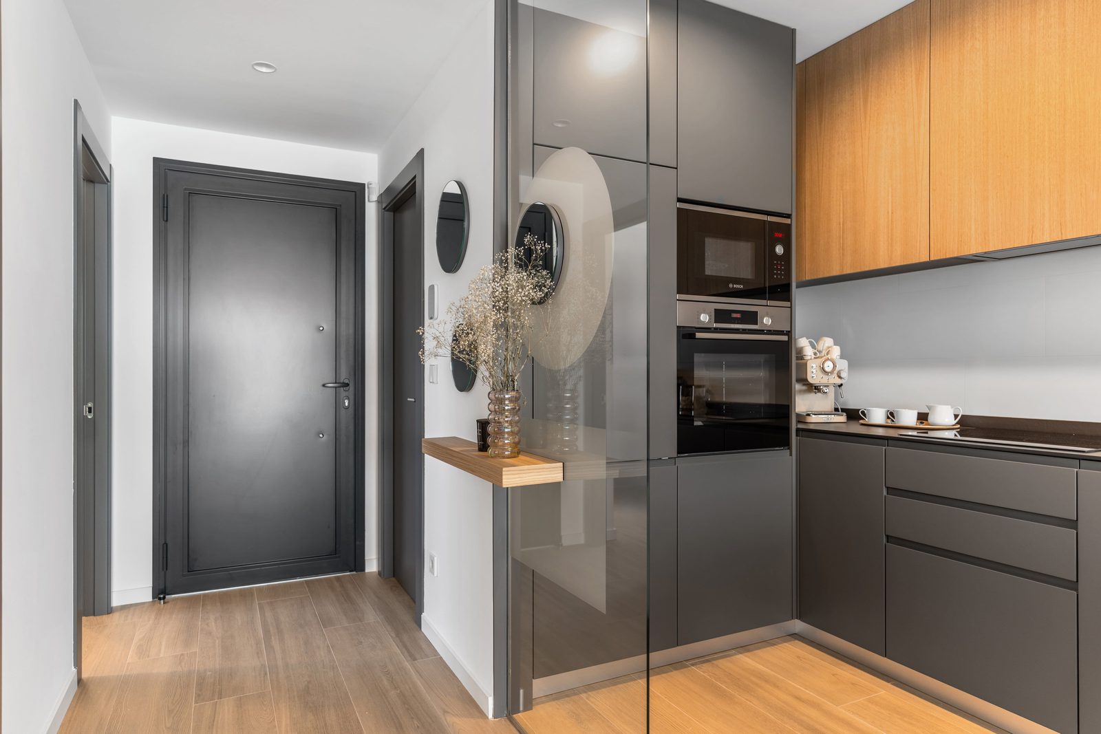 Modern kitchen with built-in appliances and a doorway in a 3-bedroom apartment in Benitachell - The Estates