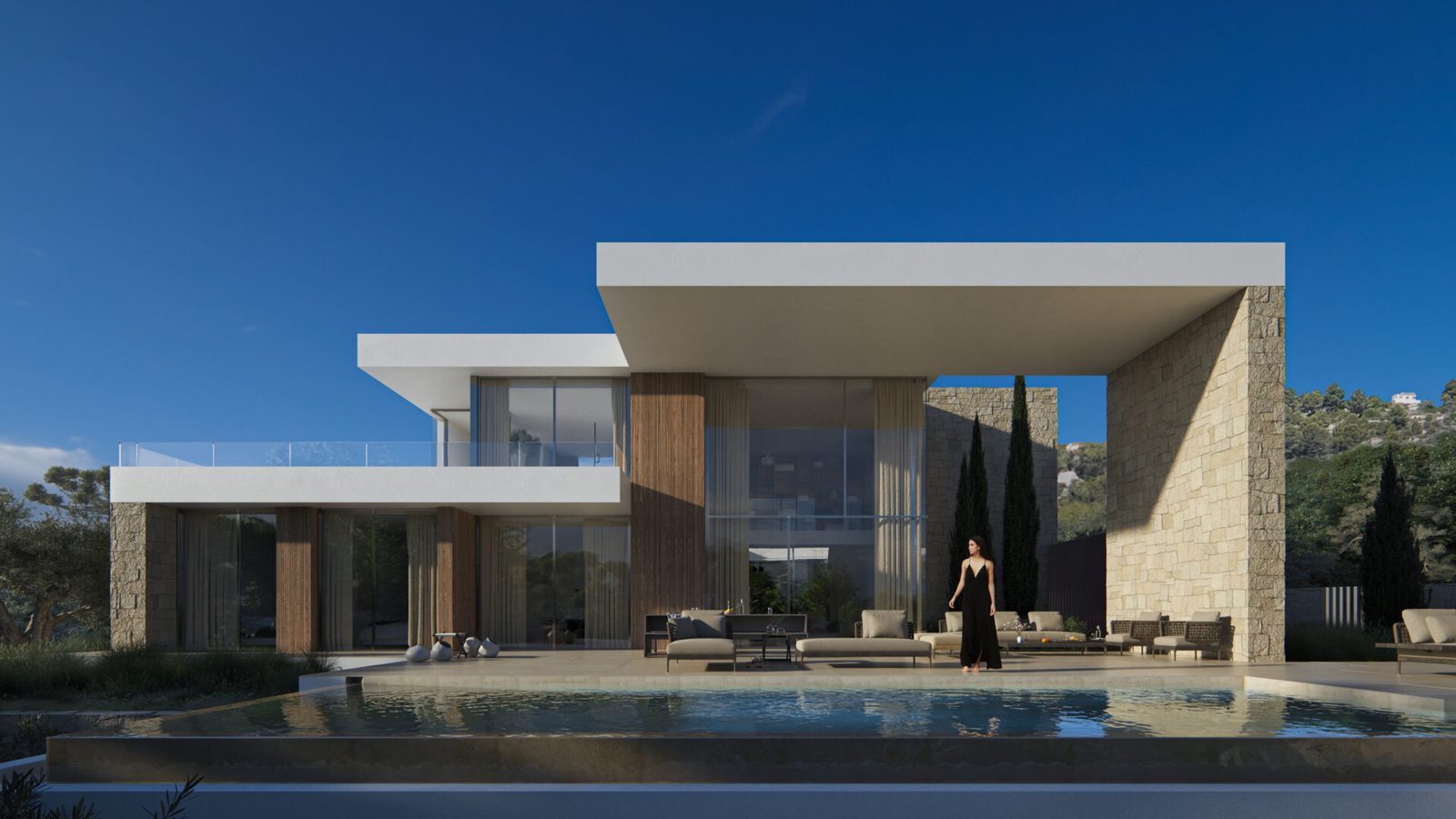Modern villa exterior with pool, stone walls and expansive glass doors in Moraira - The Estates