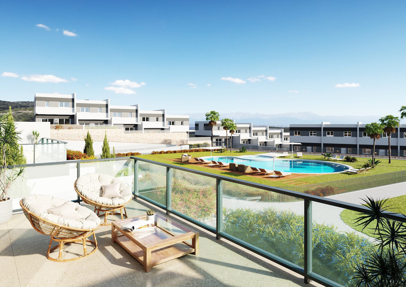 A view of a garden and pool area from a balcony on a 3-bedroom townhouse in Finestrat - The Estates